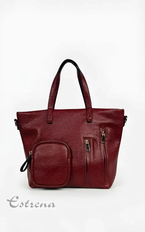 Bolso de asa corta color burdeos con bolsillos de cremallera verticales y un monedero exterior cuadrado de Estrena Moda.
